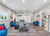 Thumbnail 20 of 27 - a living room and dining room with a table and chairs