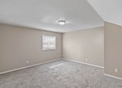 Thumbnail 13 of 27 - an empty room with carpet and a window