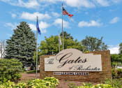 Thumbnail 25 of 28 - a sign for the gates of excellence leasing center flags