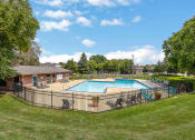 Thumbnail 21 of 28 - the swimming pool at our apartments with a fence around it
