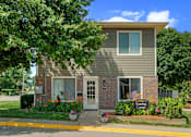 Thumbnail 10 of 26 - A house with a sign that says Leasing Center.