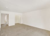 Thumbnail 17 of 19 - a bedroom with a carpeted floor and white walls