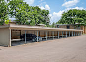 Thumbnail 21 of 24 - Car parked under a covered car port