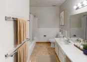 Thumbnail 9 of 19 - a bathroom with a toilet sink and bathtub