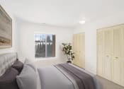 Thumbnail 7 of 19 - a bedroom with a large bed and a large window