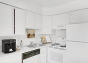 Thumbnail 6 of 19 - a kitchen with a sink stove and refrigerator