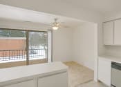 Thumbnail 13 of 19 - a kitchen and dining area overlooking a private balcony