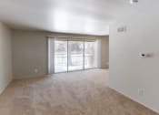 Thumbnail 10 of 19 - a bedroom with a sliding glass door leading to a balcony