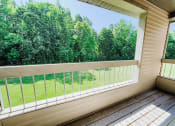 Thumbnail 17 of 24 - balcony overlooking woods at huntington glen apartments
