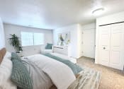 Thumbnail 3 of 24 - a bedroom with a bed and a closet