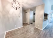 Thumbnail 7 of 24 - dining room with connected kitchen and hardwood style flooring