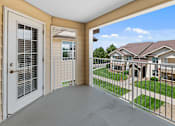 Thumbnail 14 of 29 - A view from the balcony of a house with a white door and a white fence.