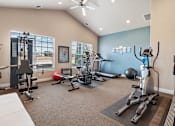 Thumbnail 16 of 29 - A spacious home gym with a variety of exercise equipment.