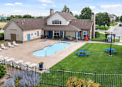 Thumbnail 27 of 29 - A pool and patio area in front of a house.