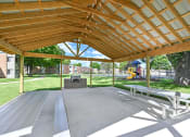 Thumbnail 18 of 25 - Grilling and Picnic Area at Harbor Lake Apartments