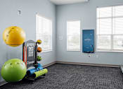 Thumbnail 19 of 38 - Fitness center with a blue wall and a green exercise ball.