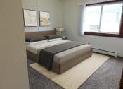 Thumbnail 6 of 22 - bedroom with natural light in heritage manor apartments