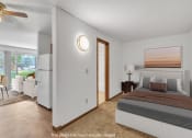 Thumbnail 5 of 22 - a bedroom with a bed and a door to a living room
