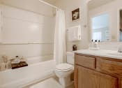 Thumbnail 6 of 15 - bathroom with a sink, toilet, and shower