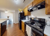 Thumbnail 2 of 15 - apartment kitchen with black appliances including dishwasher