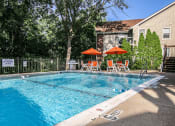 Thumbnail 9 of 15 - outdoor swimming pool at apartment complex