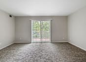 Thumbnail 5 of 16 - apartment living room with a sliding glass door to a balcony