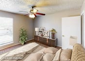 Thumbnail 5 of 25 - A living room with a couch, a ceiling fan, and a window.