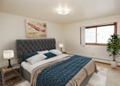 Thumbnail 8 of 18 - a bedroom with a large bed and a window