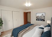 Thumbnail 9 of 18 - a bedroom with a large bed and closets
