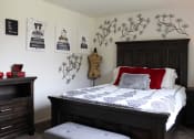 Thumbnail 5 of 17 - apartment bedroom with a bed and a dresser