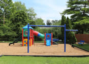 Thumbnail 9 of 17 - a playground with a slide at Imperial Gardens Apartments