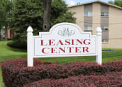 Thumbnail 17 of 17 - the leasing center sign in front of apartment building