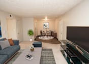 Thumbnail 1 of 23 - apartment living room with a couch a table and a tv
