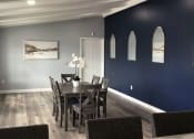 Thumbnail 9 of 16 - table and seating area in clubhouse at indian springs apartments