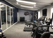 Thumbnail 12 of 16 - gym area at indian springs apartments with tredmills