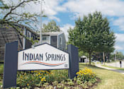 Thumbnail 17 of 20 - A sign that says Indian Springs in front of some houses.