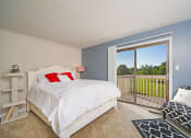 Thumbnail 3 of 14 - Primary bedroom with Attached Balcony at Indian Woods Apartments in Evansville