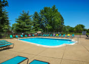 Thumbnail 5 of 14 - Pool and Sundeck Area at Indian Woods Apartments