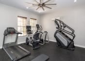 Thumbnail 9 of 34 - apartment gym with cardio machines