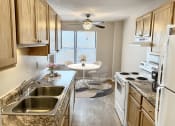 Thumbnail 4 of 20 - Apartment Kitchen with Dishwasher