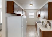 Thumbnail 5 of 11 - Fully-Equipped Apartment Kitchen