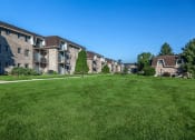 Thumbnail 21 of 23 - exterior of lamberton lake apartments with lots of green area