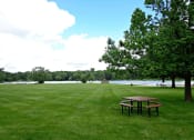 Thumbnail 15 of 23 - picnic area along side lamberton lake in grand rapids at Lamberton Lake Apartments 