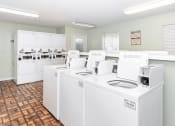 Thumbnail 5 of 33 - laundry center at apartments