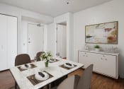 Thumbnail 20 of 29 - a dining room with a table and chairs
