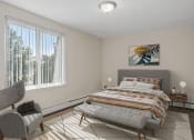 Thumbnail 4 of 25 - a bedroom with a bed and two windows