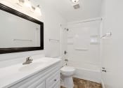 Thumbnail 5 of 15 - modern apartment bathroom with a shower tub