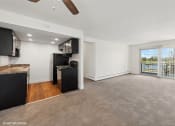 Thumbnail 2 of 15 - living room with a kitchen and a balcony