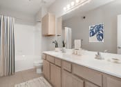 Thumbnail 9 of 33 - modern apartment bathroom with a bathtub