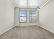 Thumbnail 6 of 15 - apartment living room with two big windows